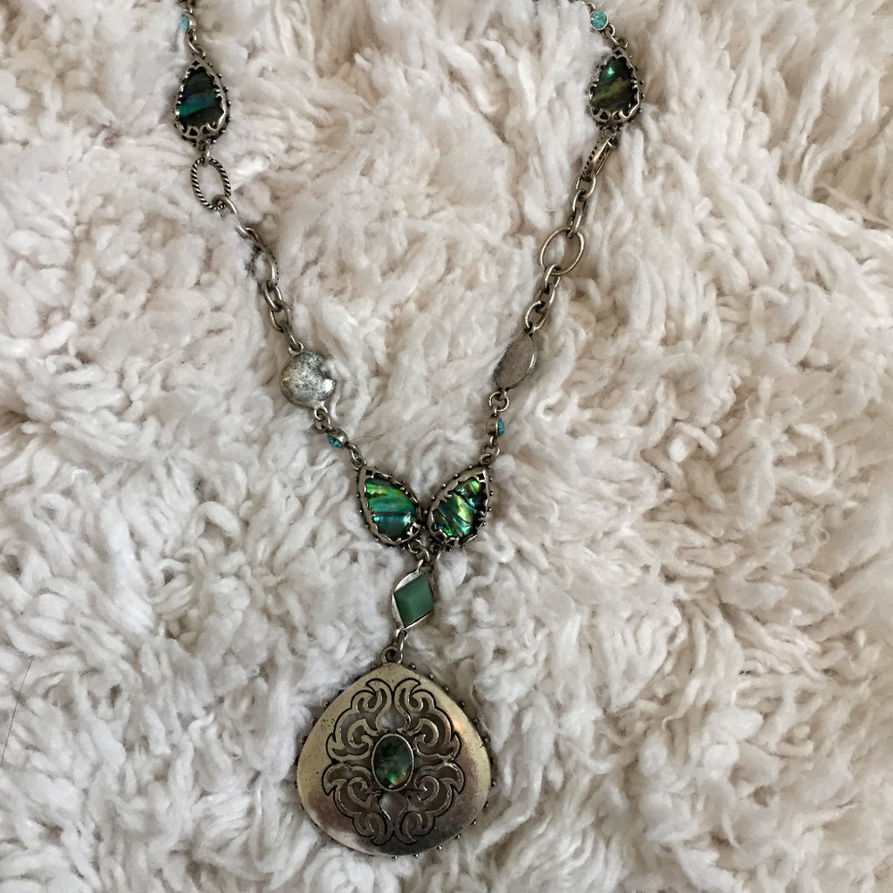 Silver necklace with inlaid stone detail