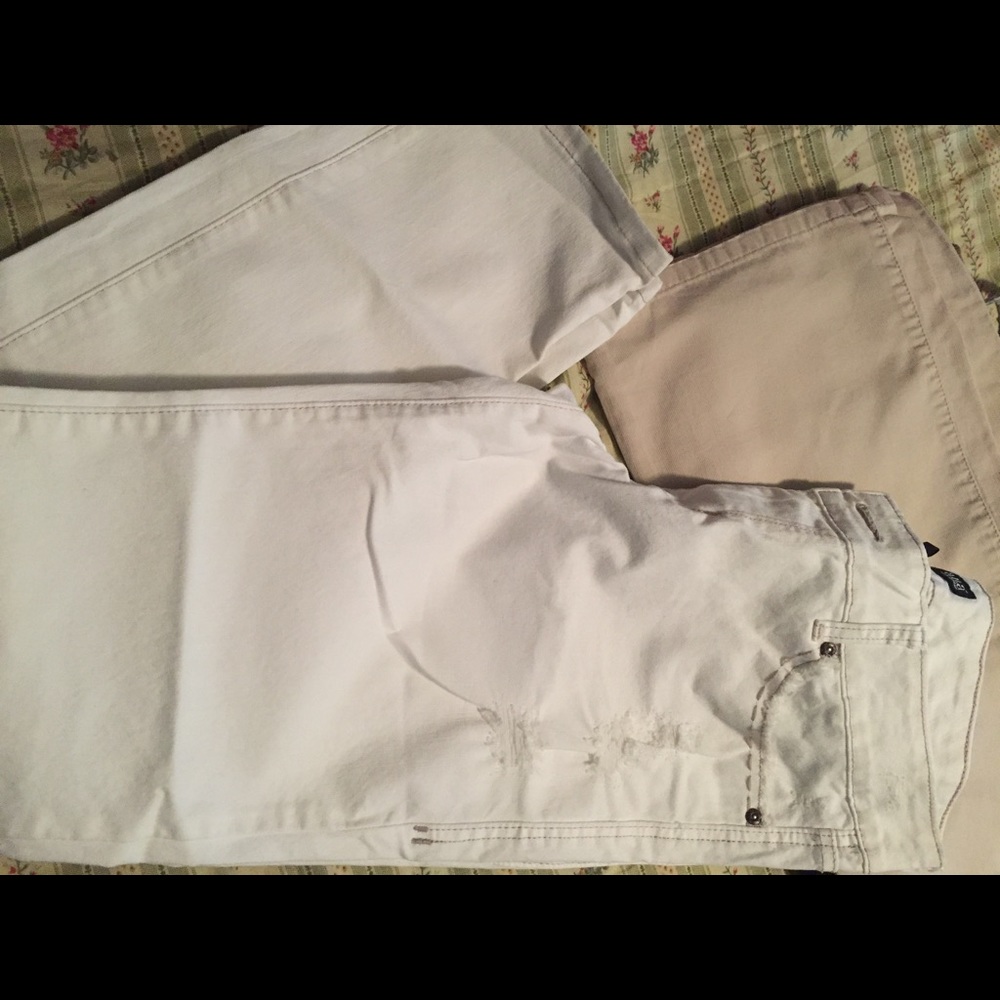 Distressed white denim boot cut jeans