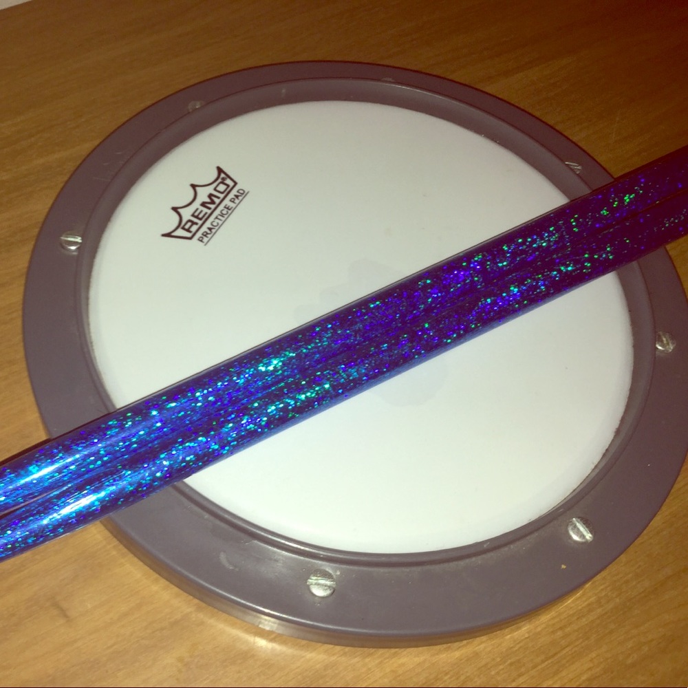 Remo practice drum pad and drumsticks