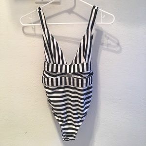 One piece bathing suit. Fits more true to XS