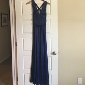 Express. Long, blue satin dress.