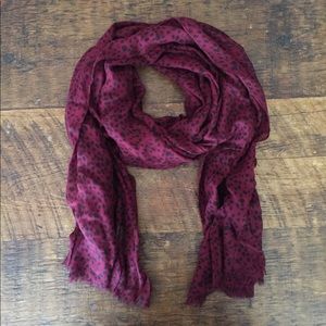 Dark red sheer scarf.