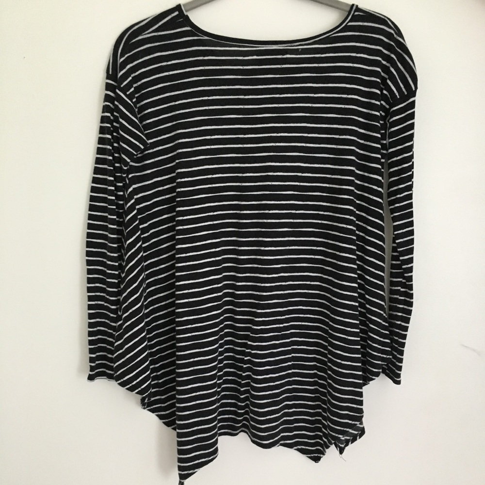 Long sleeved, black and white striped shirt