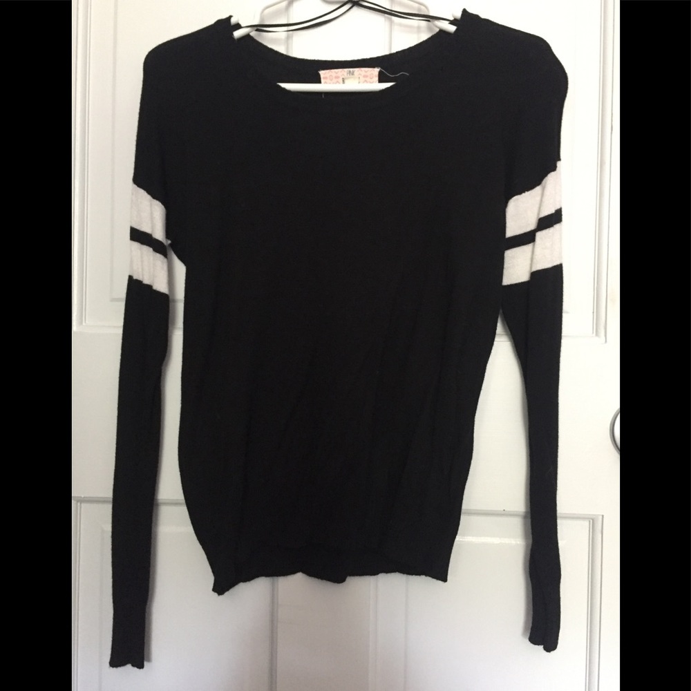 black shirt with white stripes on sleeves