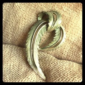 Silver feather like brooch