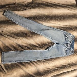 Blue skinny jeans with rhinestone detail