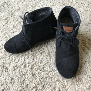 Tom black wedge booties.