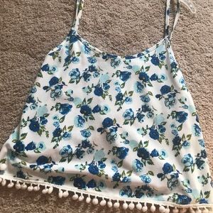 White and blue floral open back tank top.