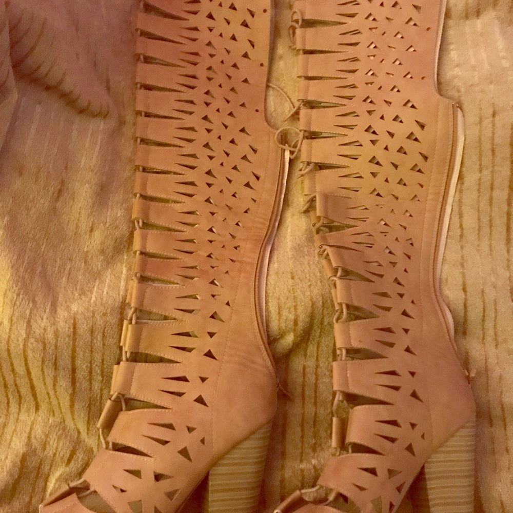 I'm selling tan over the knee laced up heel boots