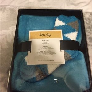 New. Still in box. Blanket with matching socks