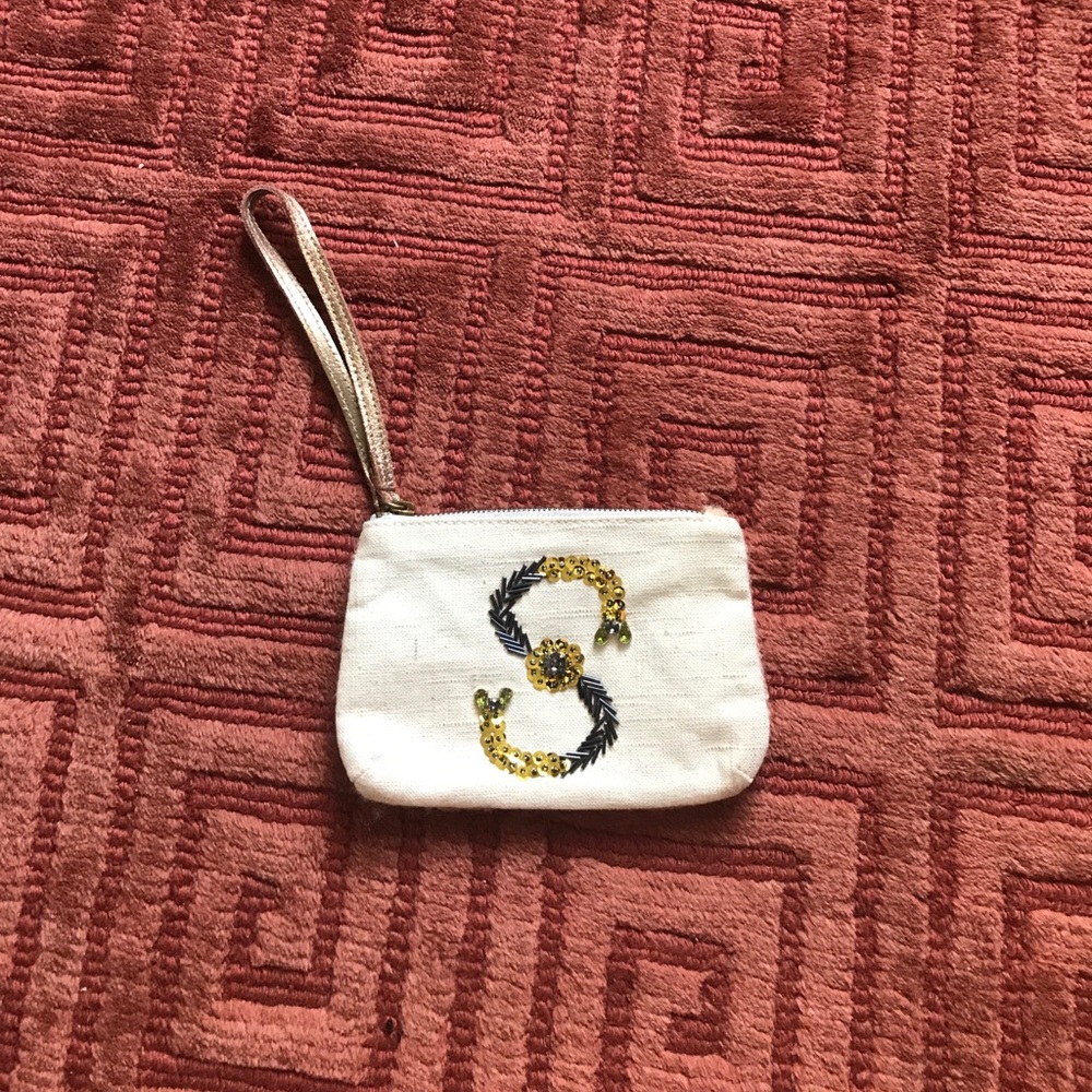 Anthropologie "S" embroidered pouch.