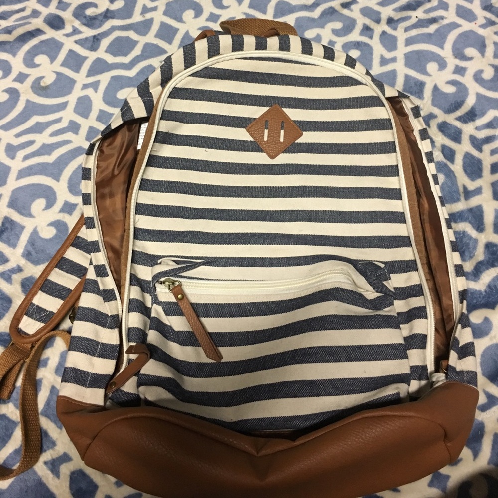 Blue and white stripped bookbag with brown details