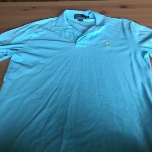 Size small teal polo shirt.