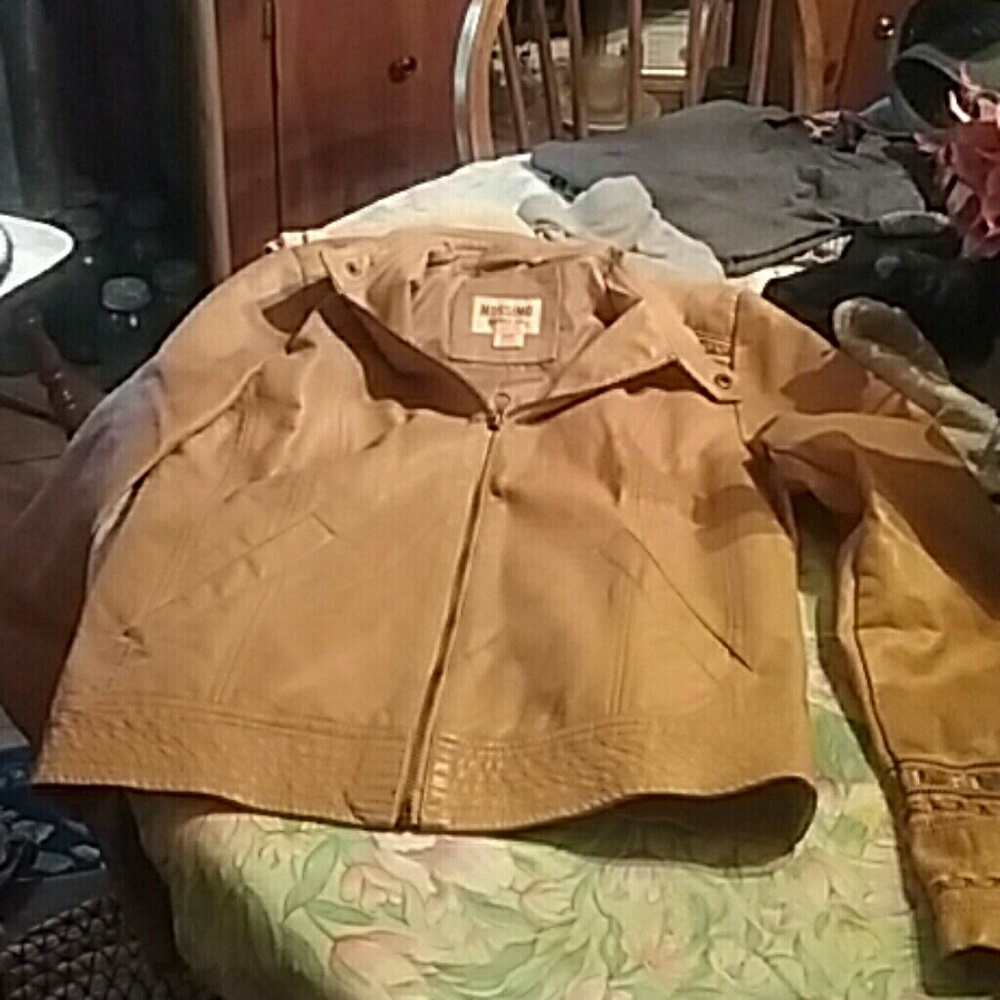 A tan leather jaket. Size medium, brand is mosimo