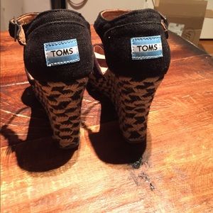 Black Toms strappy sandals.