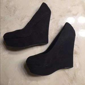 Brash black high heel wedges