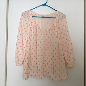 Cream colored top with pink print & tassel