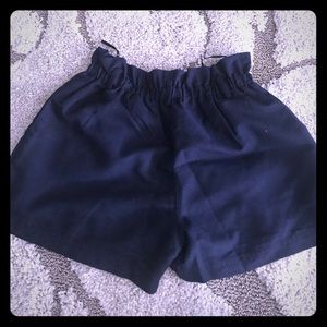 Never worn navy blue shorts with belt