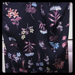 Medium, knee length navy blue dress.