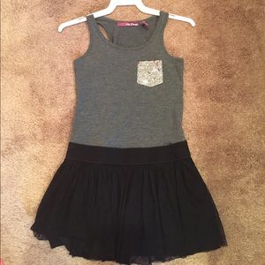 A black and grey dress with a mesh like skirt.