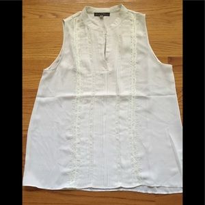 White sleeveless top