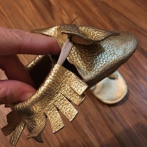 Gold leather bow moccasins