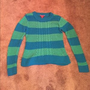 A blue and green sparkle sweater.