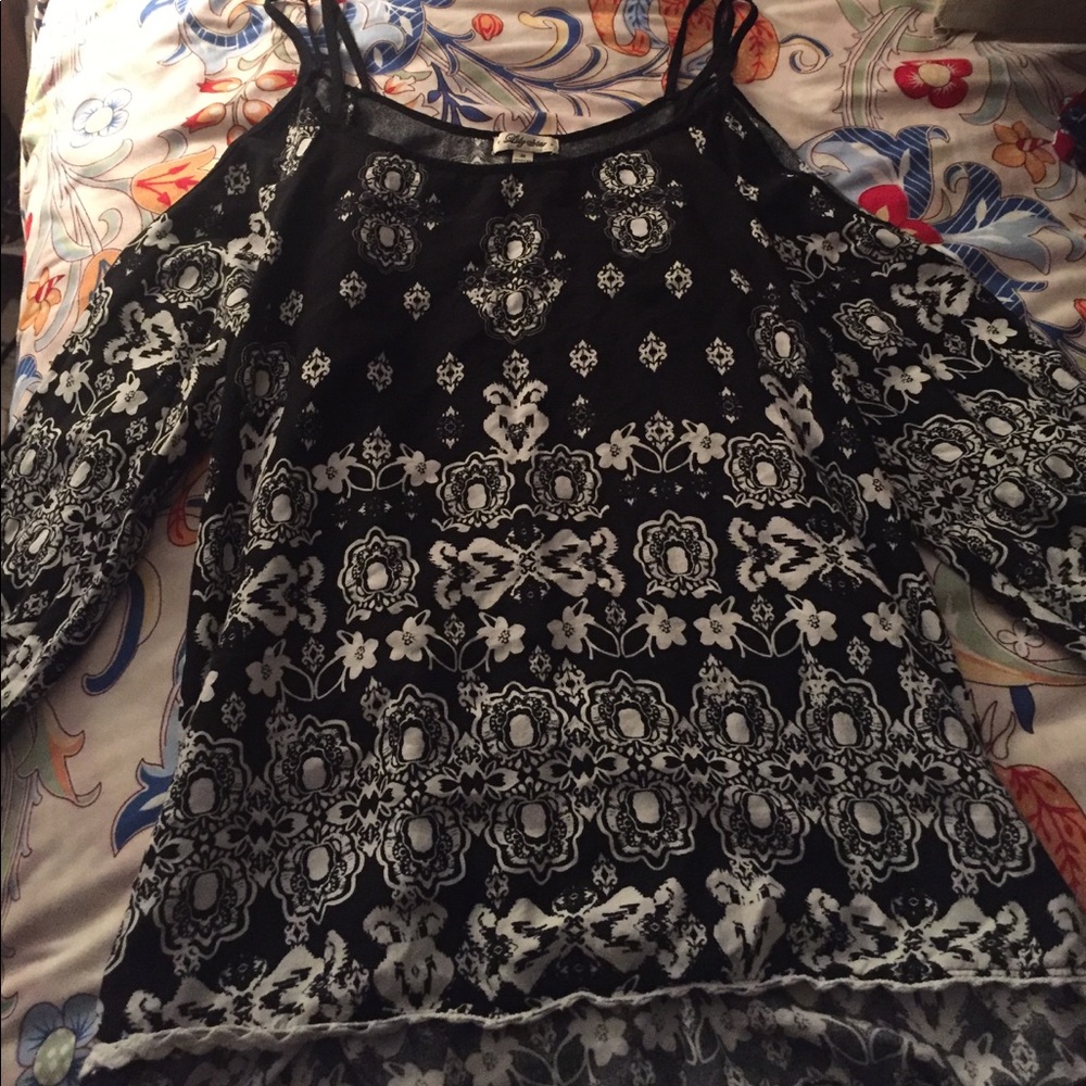 A "cold shoulder" top with black and white pattern