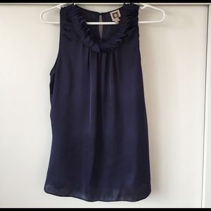 Navy blue sleeveless blouse with ruffled neckline