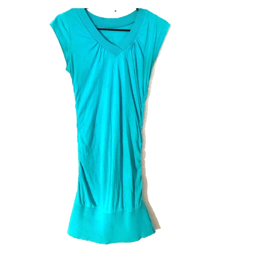 Teal green maternity shirt.