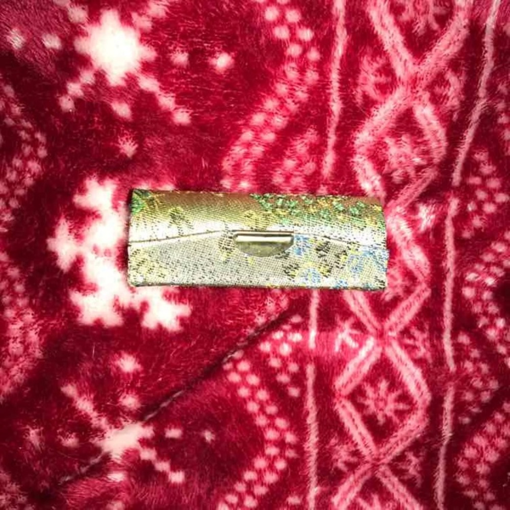 Green chopstick case with lace detailing