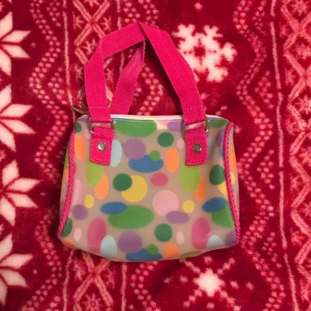Small waterproof back with rainbow polka dots