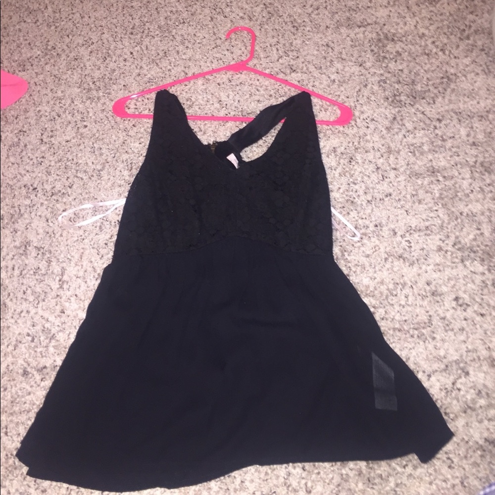 Black Tank top Zipper in back. shows of the girls