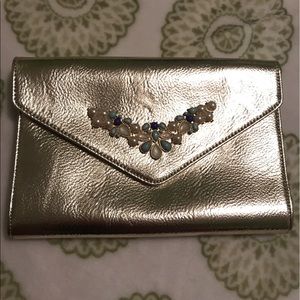 Metallic gold toned clutch with chain strap
