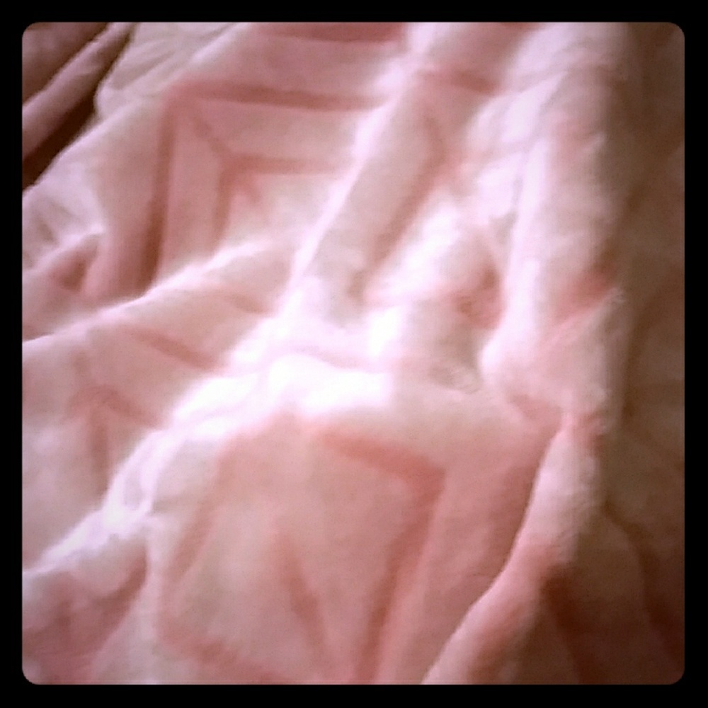 Cozy light pink blanket keeps you cozy