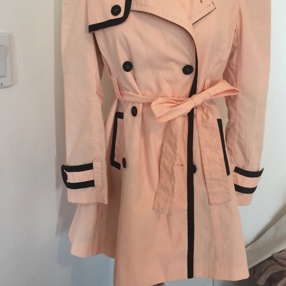 Blush and black trench coat
