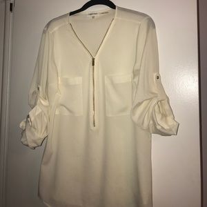 creame blouse with gold zipper