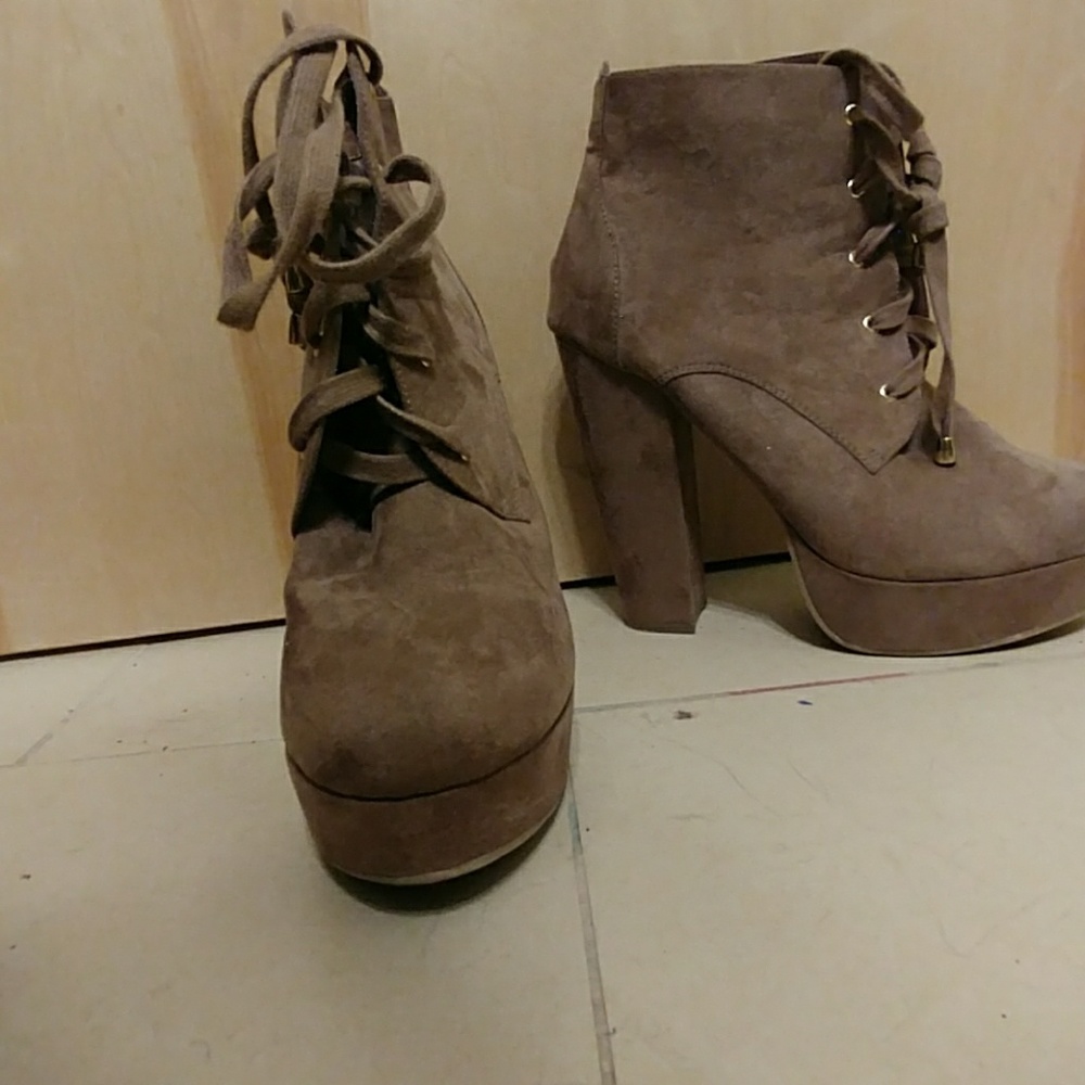 Tan high heeled booties