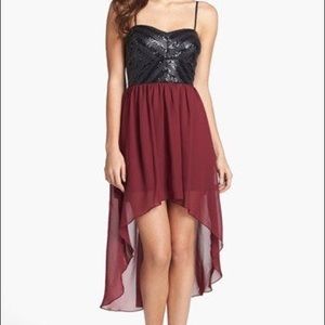 Black sequined and maroon high-low cocktail dress
