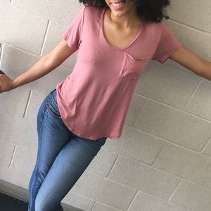 Loose long pink t-shirt with pocket on front