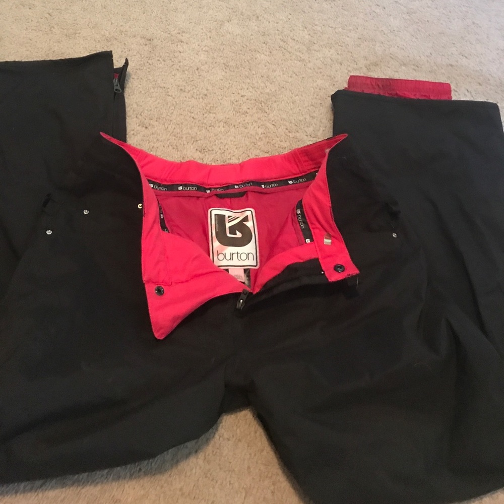 Women's black and pink burton snow pants.