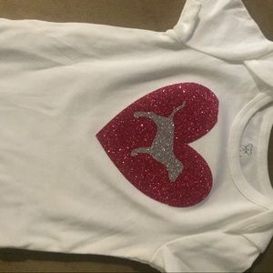 Pink baby oneies size 9months