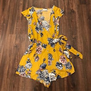 Adorable yellow floral romper. Never worn!