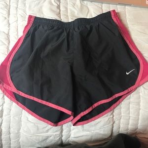 gray and pink kids Nike shorts