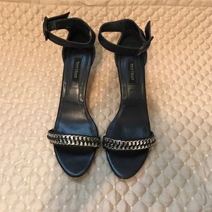 Dark navy blue heels with silver accent.