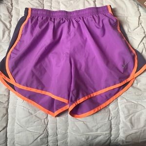 purple and neon orange Kids Nike shorts