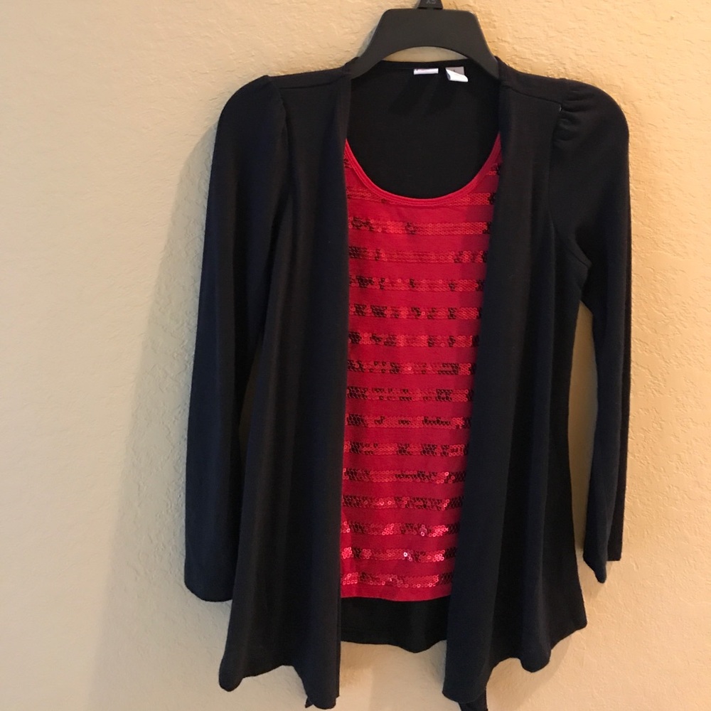 Red top with black cardigan attached