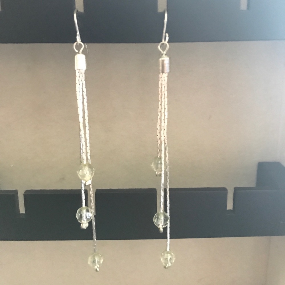 Silver earrings with clear beads.