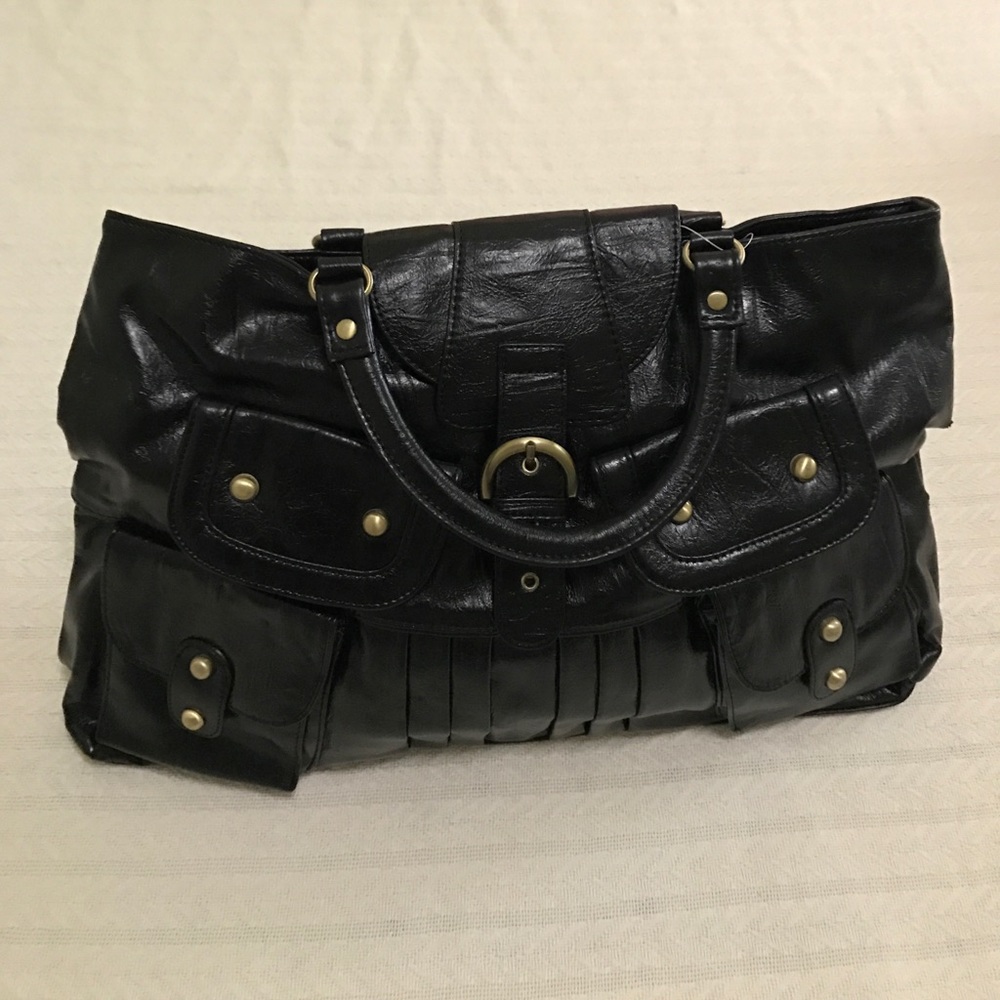 Black hand bag/ purse with accents.