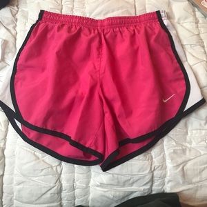 Dark pink kids Nike shorts